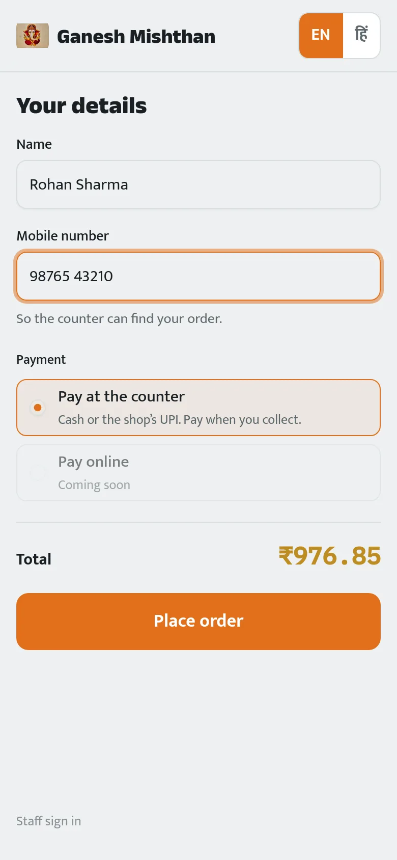The checkout screen asking only for a name and mobile number, with pay-at-the-counter selected