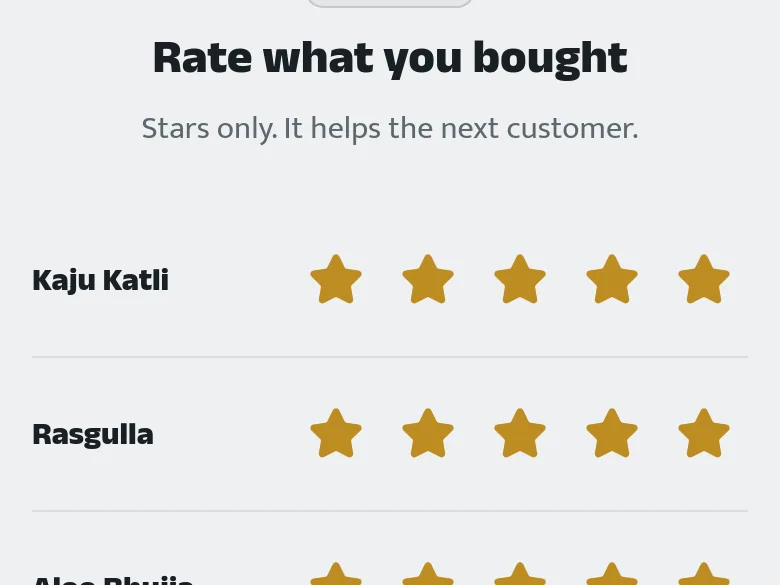 A customer rating their collected order — Kaju Katli and Rasgulla each with five stars filled in